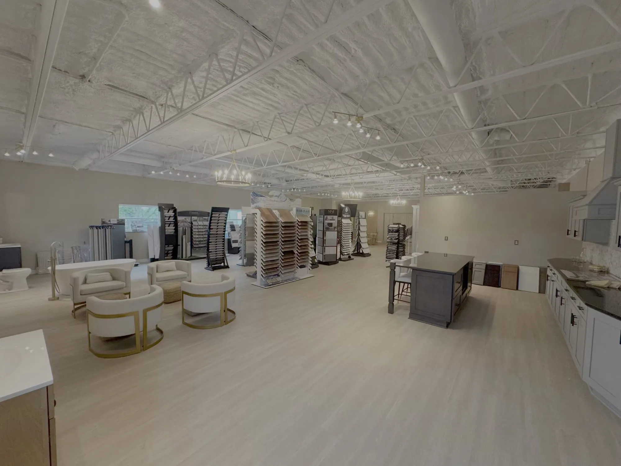 Inside Steel Valley Showroom: kitchen displays, tile and flooring racks, and a seating area