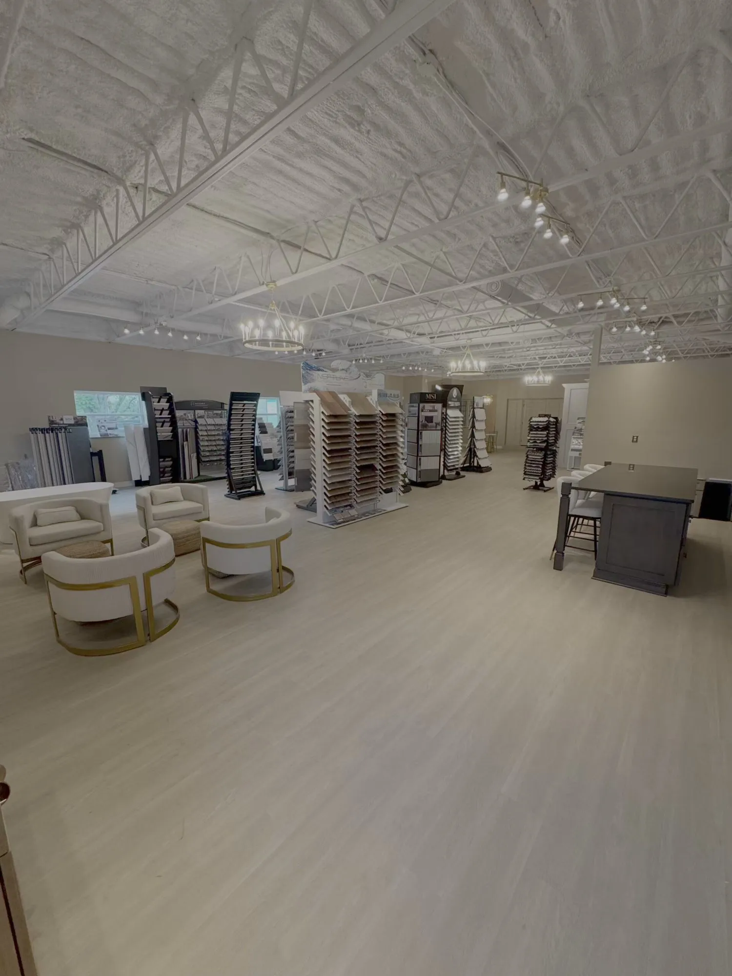 Seating area and material displays inside Steel Valley Showroom